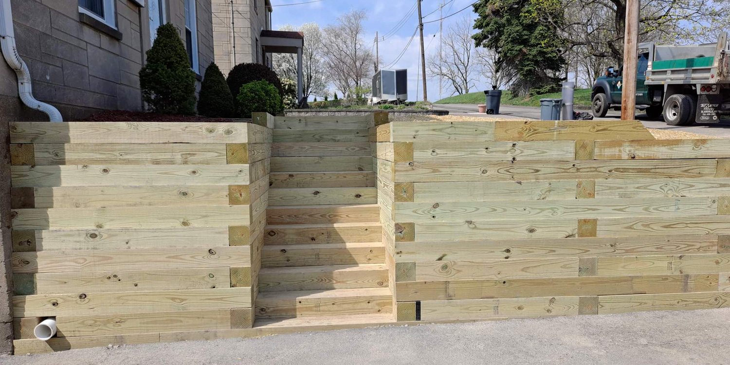 McGinn Hardscaping - Timber Retaining Wall