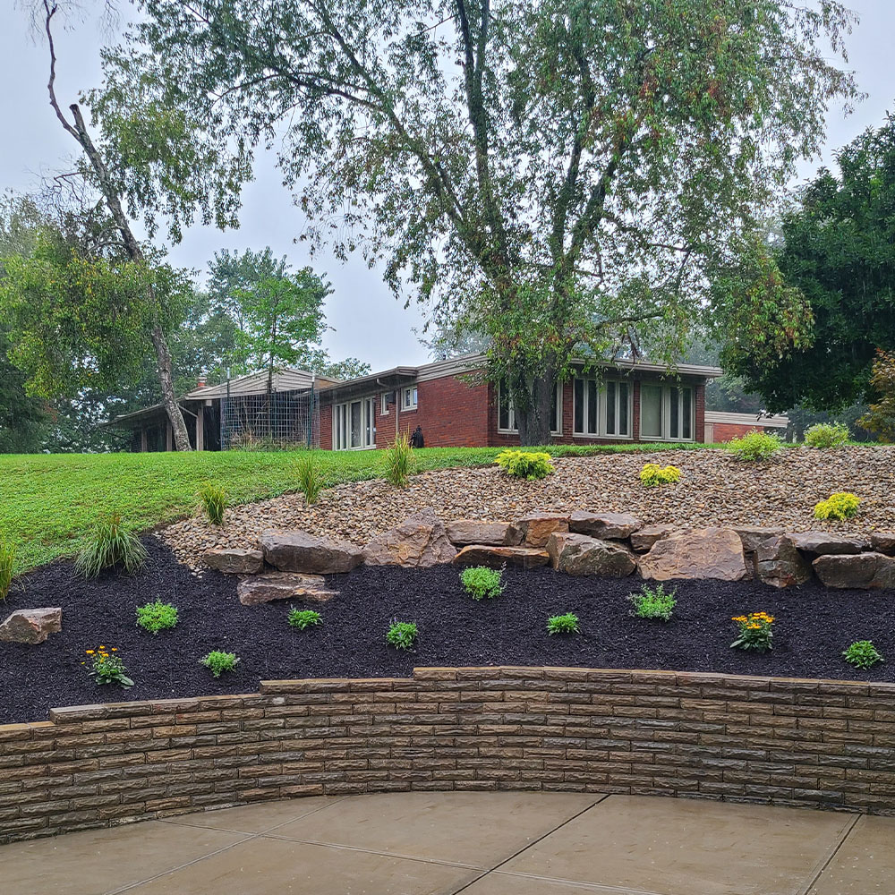 McGinn Landscaping - New Design Install by Driveway Retaining Wall